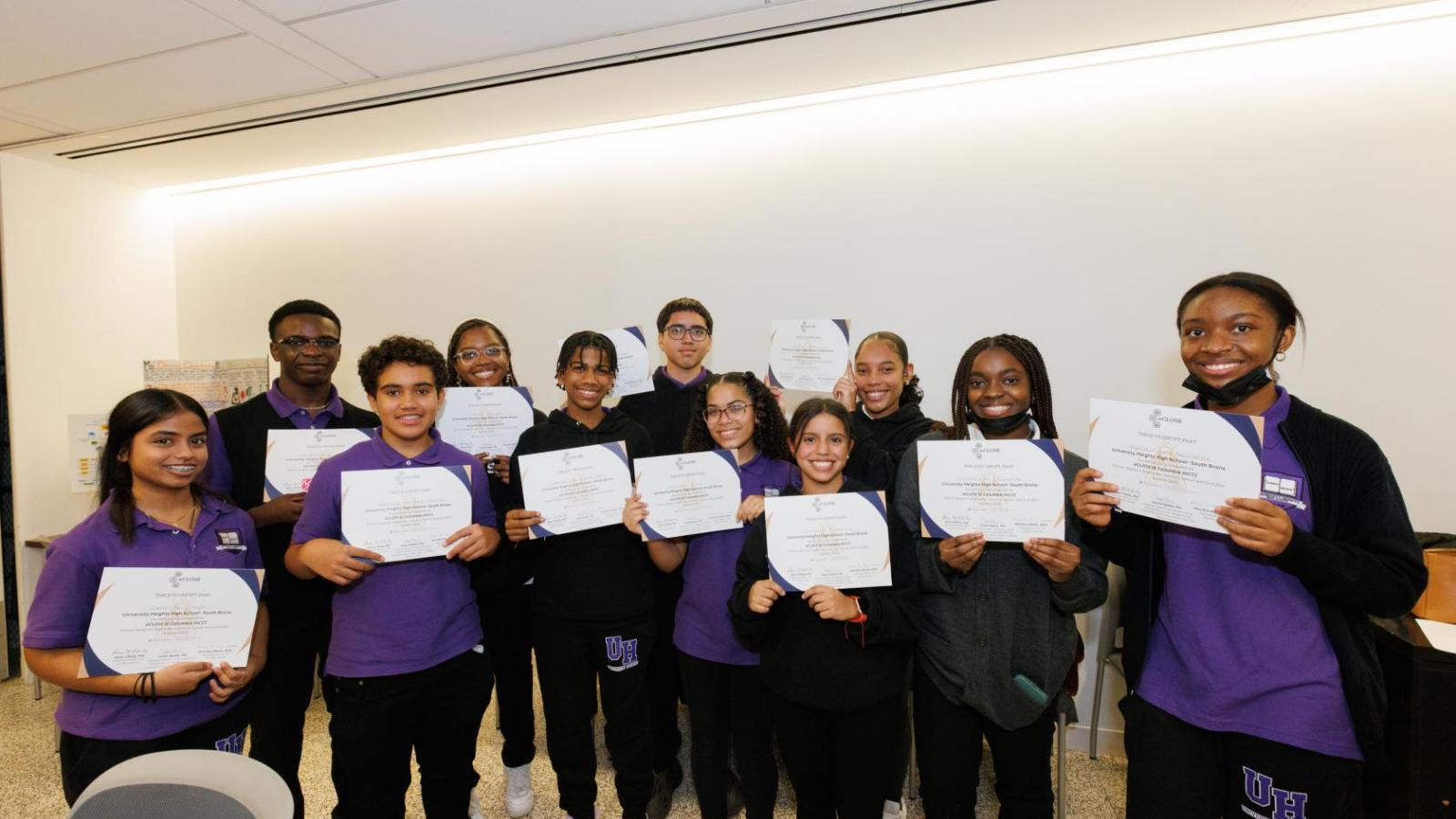 Group shot of high school students with their completion certificates