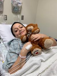 Photo of patient May Leahy in a hospital room