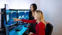 Katja Pinker-Domenig and Janice Sung review a breast MRI on a computer screen.