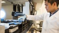 researcher prepares batch of samples for high-throughput screening