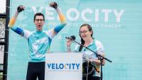 Nathan Rosin raises his arms in celebration after completing the Velocity ride