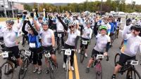A large group of riders celebrate at the end of the 2019 Velocity Ride