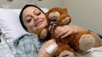 Photo of patient May Leahy in a hospital room