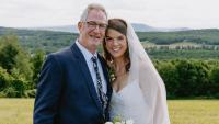 Jeffrey Pulver with his daughter at her wedding on their family farm.