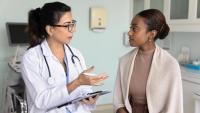 a patient speaking with a physician.
