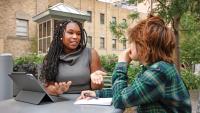 Jasmine McDonald speaking with a YES student.
