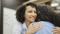 Doctor and patient hugging