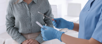 Doctor opening test swab in front of patient