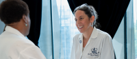 Columbia doctor talking to cancer survivor